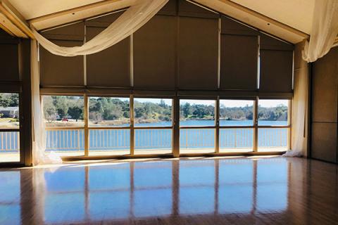 Image of the interior of the Pavilion on the Lake looking out on the Atascadero Lake.