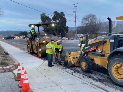 Image of large equipment and road repairs underway.