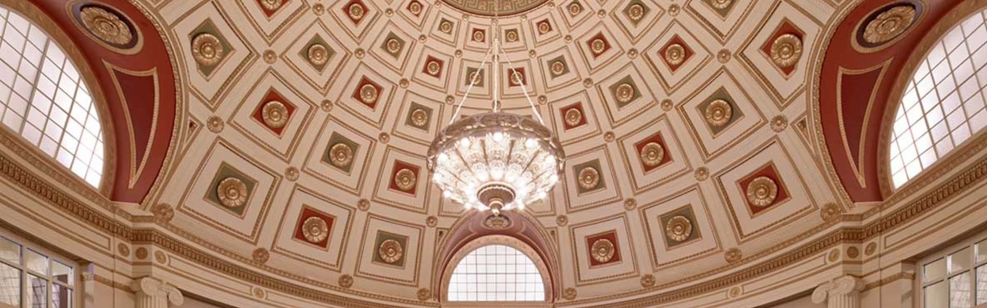 Photo of ceiling and chandelier in the Atascadero City Hall lobby.