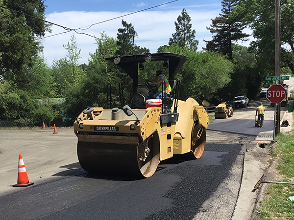 Image of large equipment and road repairs underway.