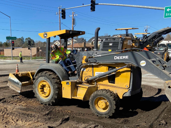 Image of large equipment and road repairs underway.