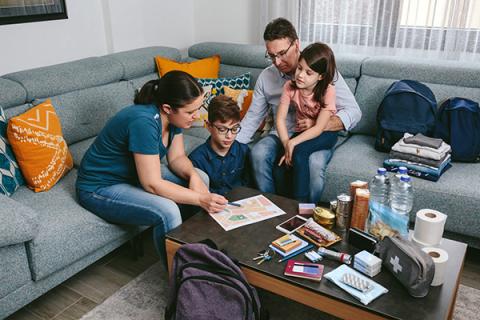 Family preparing for emergencies, talking with kids