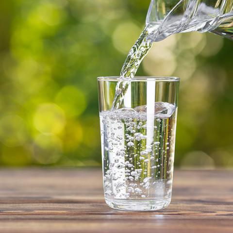 Pitcher of water and glass