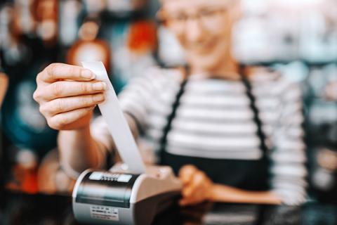 Woman holding a receipt