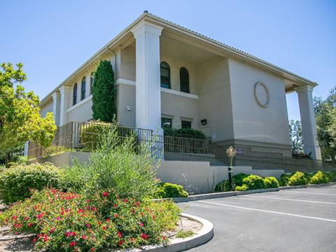 Image of the Atascadero Library building with landscaping in front.