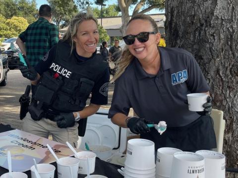 Police staff volunteering at National Night Out event.