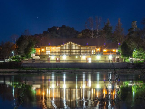 Pavilion on the Lake at night with vibrant reflections on the Atascadero Lake.