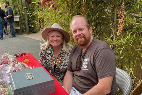 Smiling volunteers at a Zoo event.