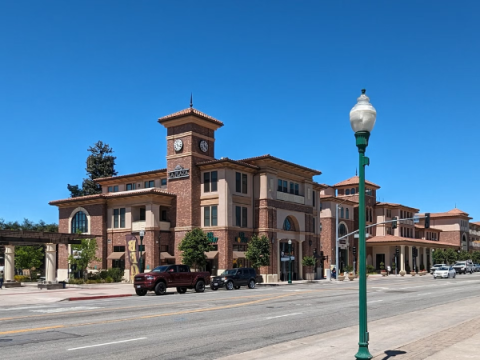 Daytime view of El Camino Real between East Mall and West Mall prior to The ECR Project improvements, showing the roadway and surrounding streetscape before construction updates.